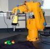 Robot arm with camera and wooden blocks